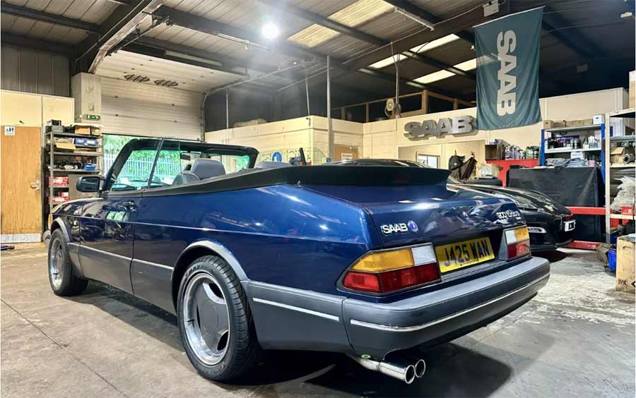 Rear view of the 1992 Saab 900 T16S Convertible in Le Mans blue, showcasing its distinctive design and Aero Carlsson alloy wheels. Currently listed on eBay, this classic convertible is a must-have for Saab enthusiasts.