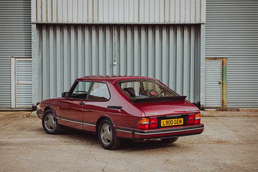 Rear view of the 1993 Saab 900 Turbo Ruby Edition, capturing its elegant design and the distinctive '900 GEM' license plate.