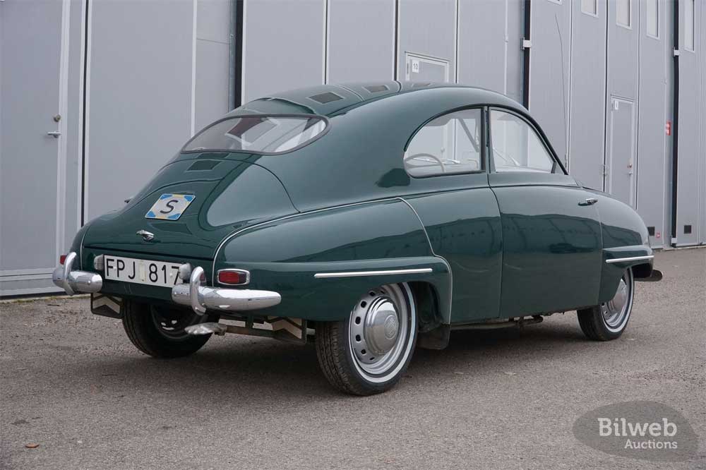 Rear view of a pristine 1955 Saab 92B, showcasing its elegant curves and classic post-war automotive design.