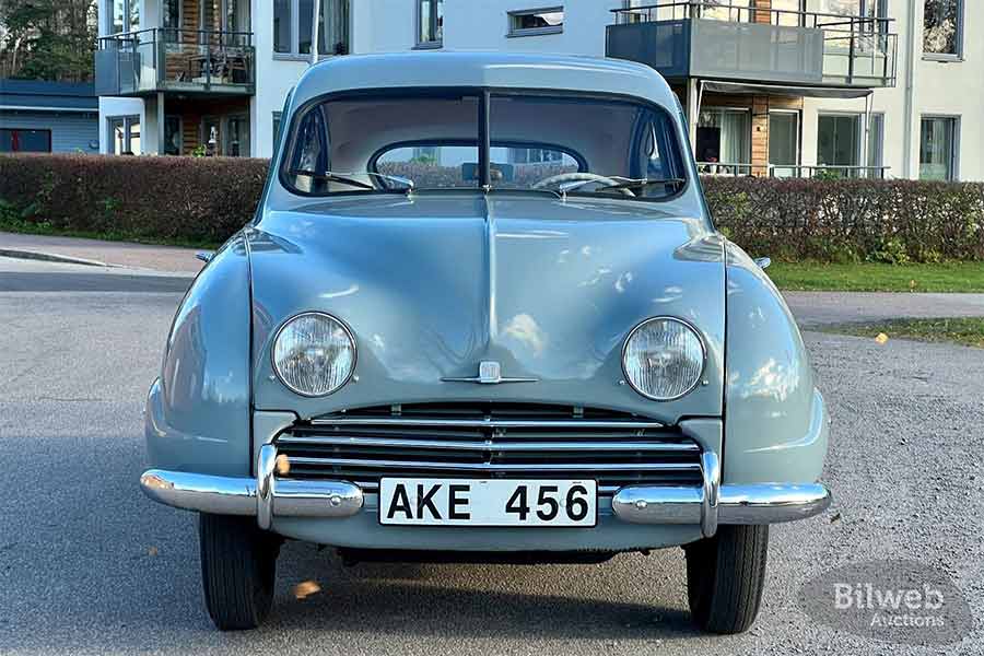 The unmistakable face of the 1955 Saab 92B De Luxe, with its iconic two-stroke power and aerodynamically efficient design—a pioneering force in Swedish automotive history.