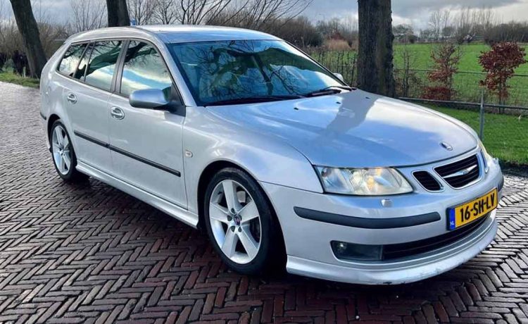 Saab 9-3 V6 Aero Sportwagon parked, showcasing its sleek silhouette and shiny alloy 17" wheels