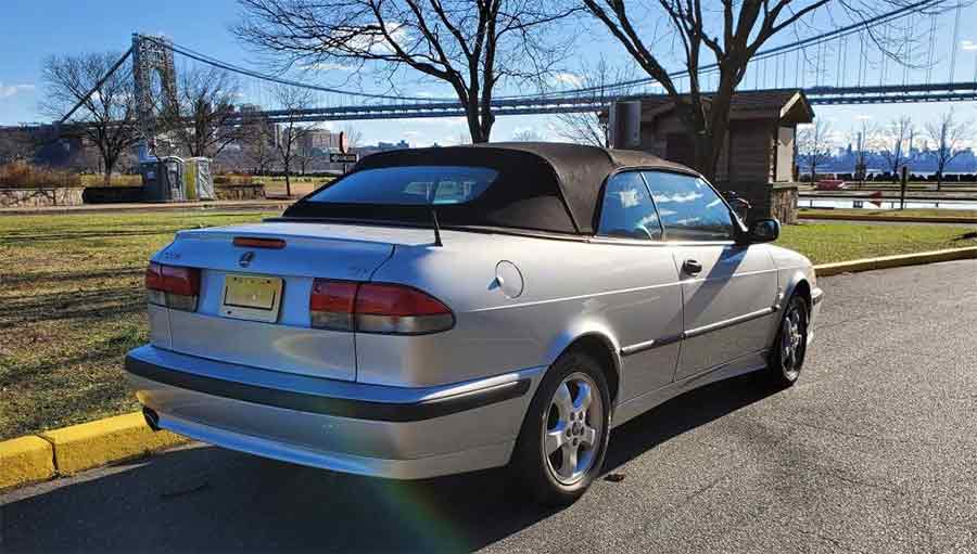 the 2001 Saab 9-3 SE Convertible showcases its sleek and timeless design, set against the picturesque backdrop of the George Washington Bridge. The impeccable silver finish and classic lines of the 9-3 SE highlight Saab's dedication to both form and function.