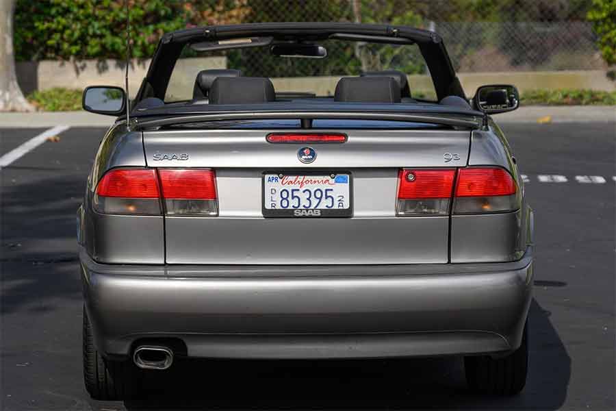 Rear view of the 2001 Saab 9-3 Viggen Convertible, showcasing its sleek design and California ownership. This rare model is now up for auction on Cars & Bids.