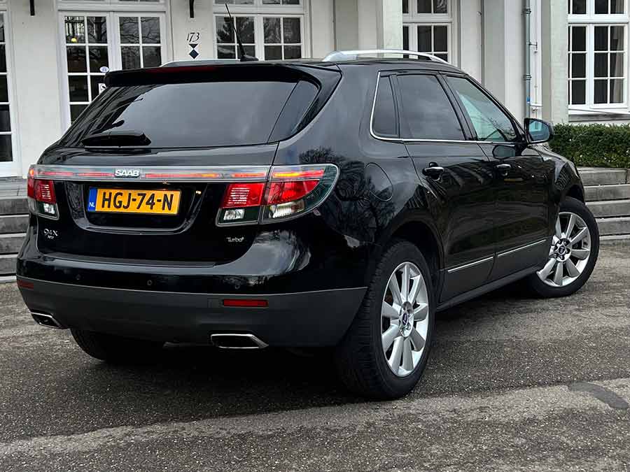  The rear of the Saab 9-4X Aero showcases its LED taillights, signature wraparound light bar, and dual exhausts, emphasizing its sporty yet refined design.