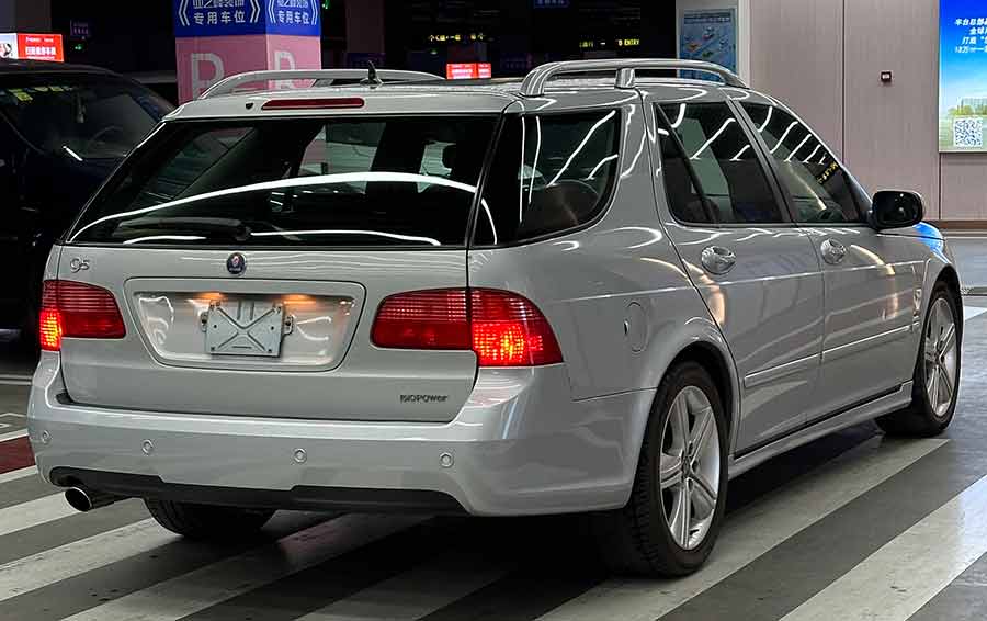 Rear view of Tony Wang's ultra-rare 2009 Saab 9-5 BioPower Griffin Wagon, showcasing pristine condition and the iconic BioPower badge, a true collector's piece with exceptionally low mileage