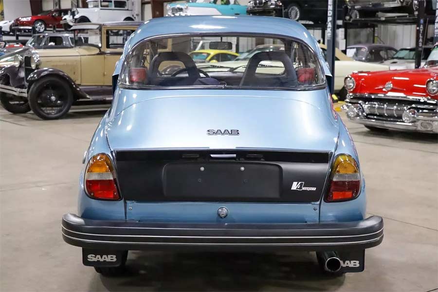 Distinctive rear styling of the 1980 Saab 96 GL Jubileum, featuring the iconic black spoiler, special badging, and Saab 99-inspired bumper design.