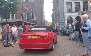 Eduard Mesritz's cherished red Saab makes a nostalgic appearance at the Lions IJsselvallei Classics rally, capturing the attention of car enthusiasts and spectators alike.