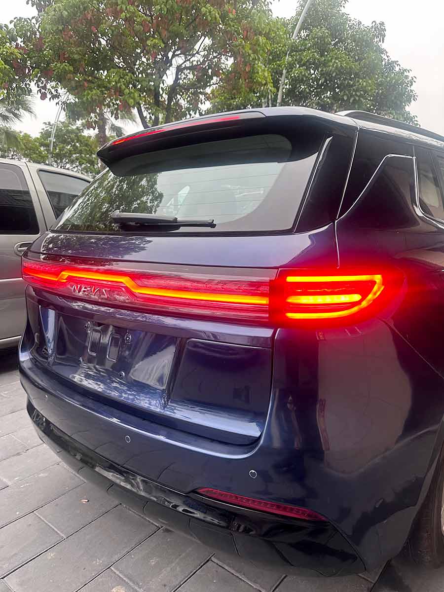 Distinctive rear-end styling of Tony Wang's NEVS L113 SUV prototype, featuring a modern LED light bar reminiscent of the iconic rear lighting from the Saab 9-5 NG.