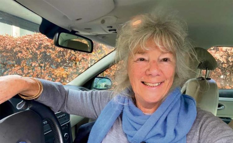 Nen van Ramshorst, behind the wheel of her Saab 9-3 Aero, proving that age is just a number when it comes to enjoying the drive.