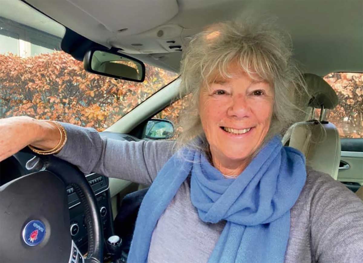 Nen van Ramshorst, behind the wheel of her Saab 9-3 Aero, proving that age is just a number when it comes to enjoying the drive.