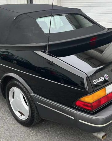 Rear view of the rare 1988 Saab 900 Turbo Convertible SIS Edition, showcasing its sleek black exterior and classic design, currently up for auction on Bring A Trailer.