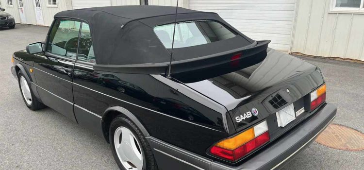 Rear view of the rare 1988 Saab 900 Turbo Convertible SIS Edition, showcasing its sleek black exterior and classic design, currently up for auction on Bring A Trailer.