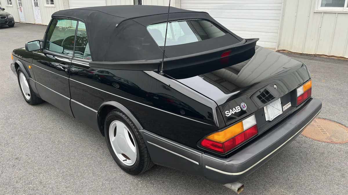 Rear view of the rare 1988 Saab 900 Turbo Convertible SIS Edition, showcasing its sleek black exterior and classic design, currently up for auction on Bring A Trailer.