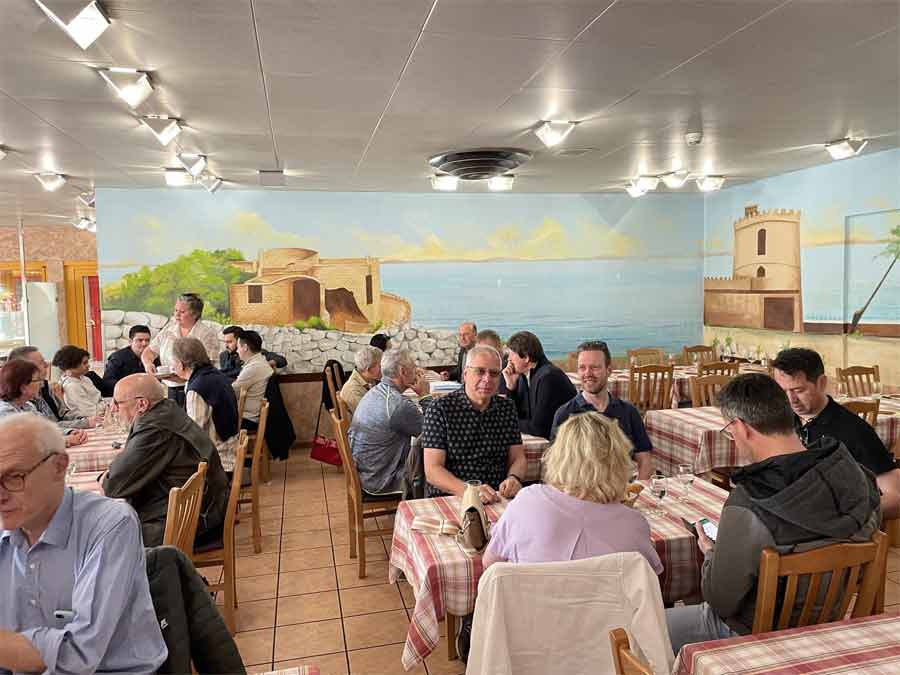 Members of the SAAB Club Romandie enjoy a convivial lunch, discussing their shared passion for SAAB’s legacy in an atmosphere as inviting as the open road.