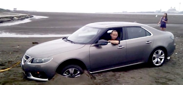 Saab 9-5ng buried in the sand