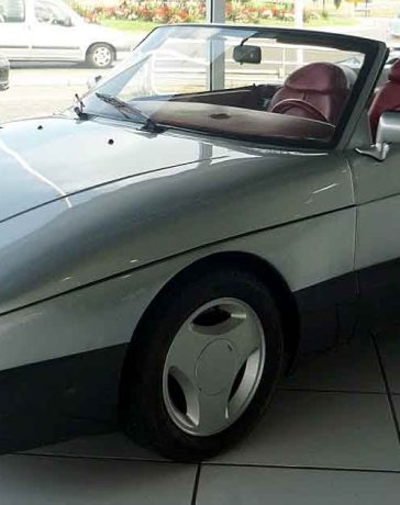 The Saab 900 Speeder on display at a showroom in Bayonne, France, showcasing its sleek design and unique features that make it a standout piece of automotive history.