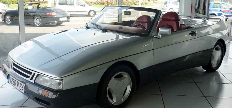 The Saab 900 Speeder on display at a showroom in Bayonne, France, showcasing its sleek design and unique features that make it a standout piece of automotive history.