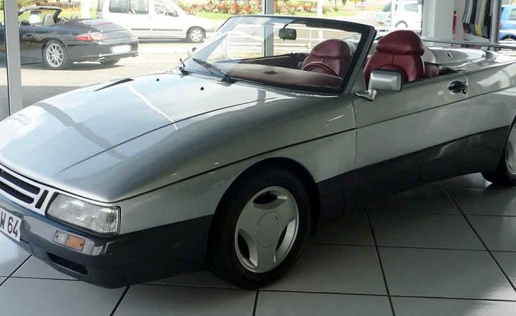 The Saab 900 Speeder on display at a showroom in Bayonne, France, showcasing its sleek design and unique features that make it a standout piece of automotive history.