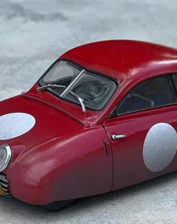 The Saab 92001 LM, a captivating 1/43 scale racing model created by Magnus Sandlund, combines fantasy and automotive history, bringing the Ursaab to life in a unique and weathered form.