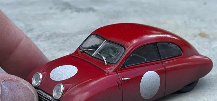 The Saab 92001 LM, a captivating 1/43 scale racing model created by Magnus Sandlund, combines fantasy and automotive history, bringing the Ursaab to life in a unique and weathered form.