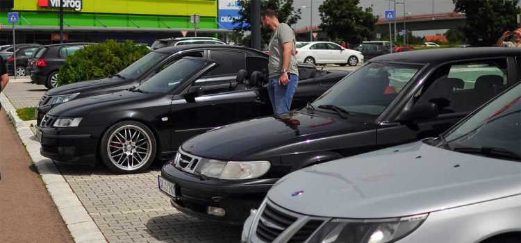 Saab enthusiasts gathered in Novi Sad, showcasing a variety of meticulously maintained Saab models.