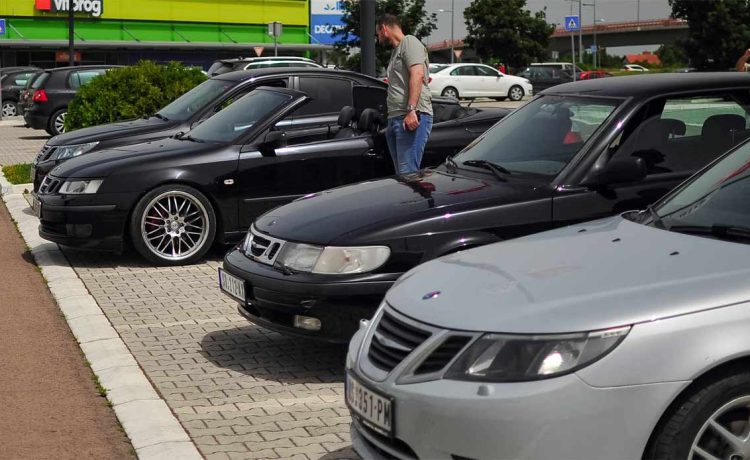 Saab enthusiasts gathered in Novi Sad, showcasing a variety of meticulously maintained Saab models.