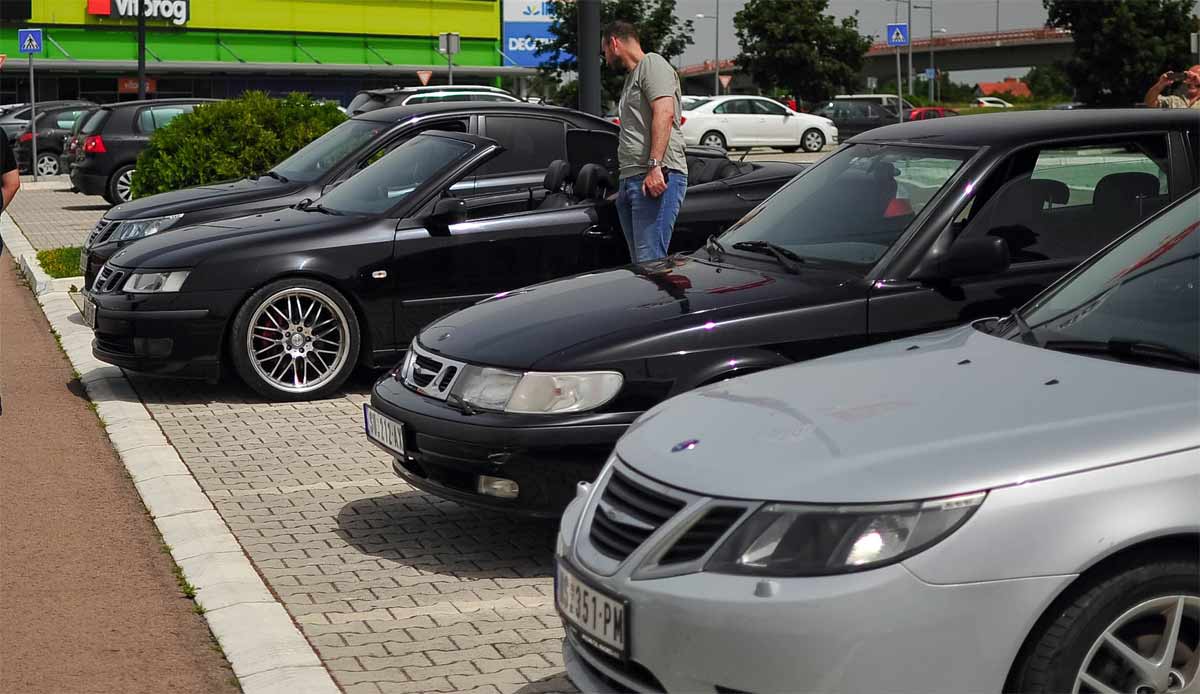 Saab enthusiasts gathered in Novi Sad, showcasing a variety of meticulously maintained Saab models.