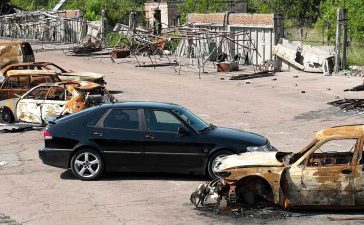 Amidst the war-torn landscape, Alexey Korobov's Saab 9-3 OG Aero stands as a symbol of resilience and determination, surpassing 300HP despite the devastation surrounding it.