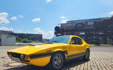 This vibrant yellow 1972 Saab Sonett III, originally red-orange, showcases its stunning transformation and meticulously maintained condition, standing as a testament to classic Swedish engineering and design.