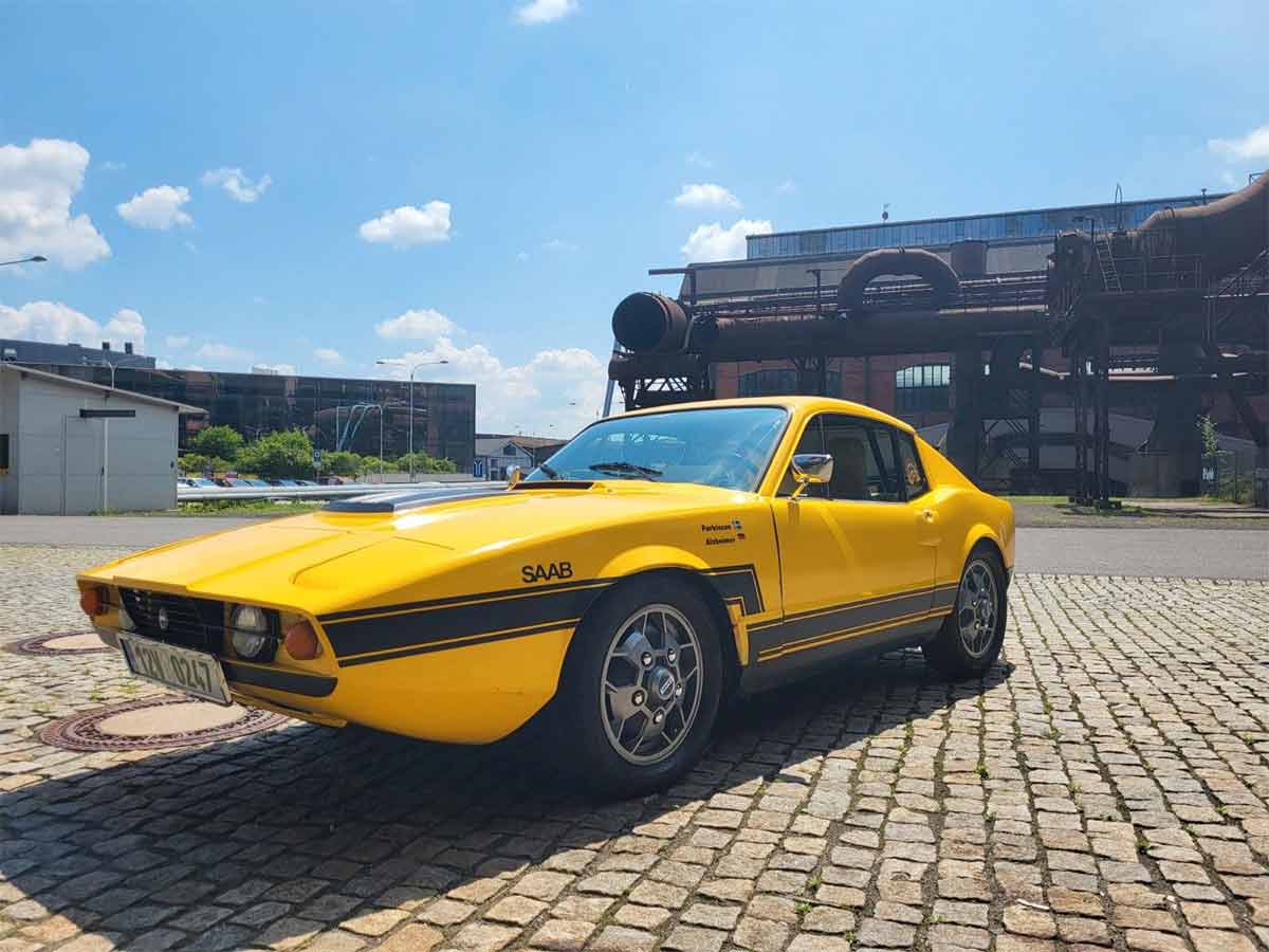 This vibrant yellow 1972 Saab Sonett III, originally red-orange, showcases its stunning transformation and meticulously maintained condition, standing as a testament to classic Swedish engineering and design.