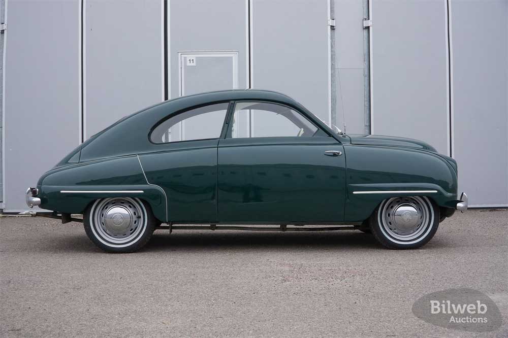 Side profile of the 1955 Saab 92B, displaying its aerodynamic design and smooth lines that echo its aeronautical heritage.