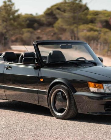 An Elegant Vision in Black: The Restored 1987 Saab 900 Turbo Cabrio 'Aero' in its Full Glory, Symbolizing a Rich Blend of History, Performance, and Swedish Craftsmanship