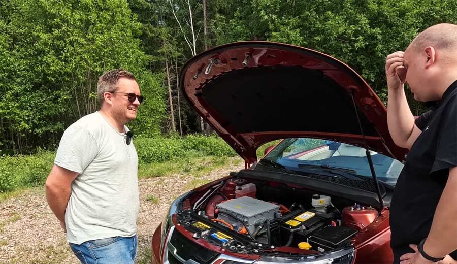 Marcus Wigh  discussing the unique construction of the WiMa 442 EV, an electric convertible based on the Saab 9-3, with Marcus from "Marcus & Manuela's Saab Channel".