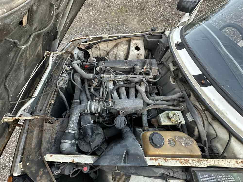 Under the Hood Potential: Explore the Engine Bay of the 1984 Saab 900 T16 3DR, Ready for Restoration and Revival