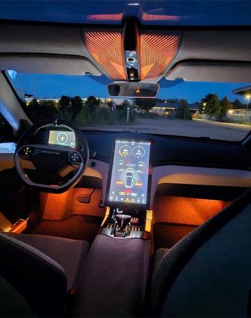 The luxurious interior of the Emily GT model, showcasing the new EV Electra logo on the steering wheel, symbolizing a new era following the acquisition of NEVS' project.