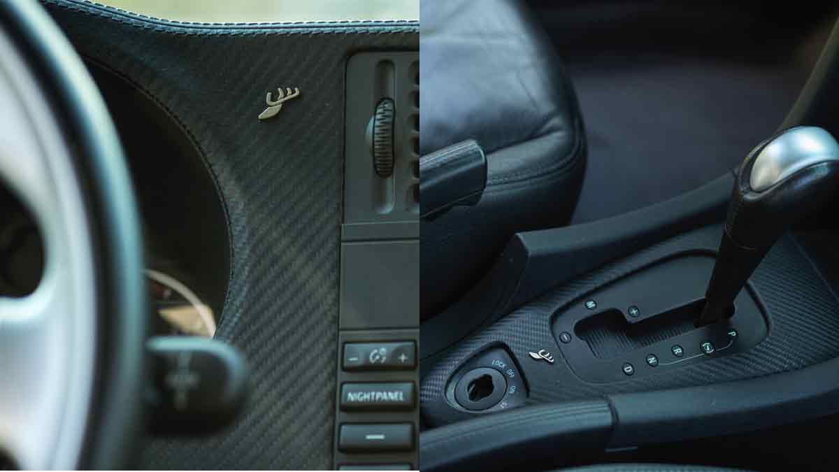 The interior of the 2009 Saab 9-3 2.0T XWD Aut SportCombi Aero, showcasing Hirsch Performance upgrades including a leather-wrapped dashboard and the elegant trim around the automatic transmission selector, complemented by sleek aluminum sports pedals.