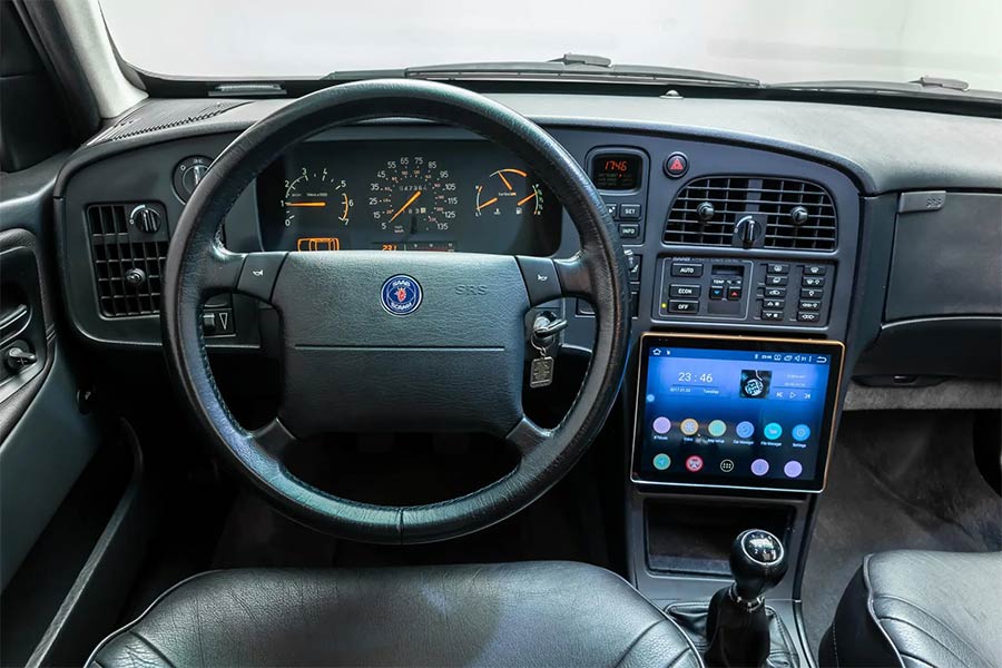 The cockpit of this 1994 Saab 9000 Aero blends classic design with a modern touch. The original leather-wrapped steering wheel and instrument cluster showcase Saab’s dedication to driver-centric functionality, while the upgraded touchscreen infotainment system offers Bluetooth streaming and enhanced connectivity for everyday use. Despite the modern update, the seller provides the option of a Continental head unit with period-correct aesthetics, allowing future owners to choose between contemporary convenience and vintage charm.