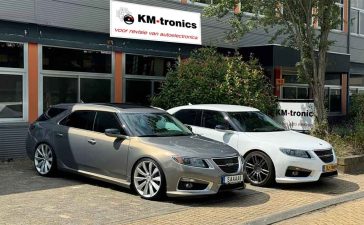 A pair of rare Saab 9-5NG models, including a white Hirsch Performance edition, visiting KM-tronics. These enthusiasts rely on KM-tronics for OEM-quality refurbished parts, helping to keep their unique Saab vehicles running and looking pristine.