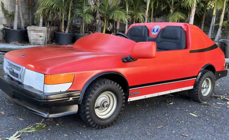 A stunning representation of the 1980s Lokari Saab Convertible Junior 006 Go-Kart, showcasing its iconic Saab 900 Turbo-inspired design.