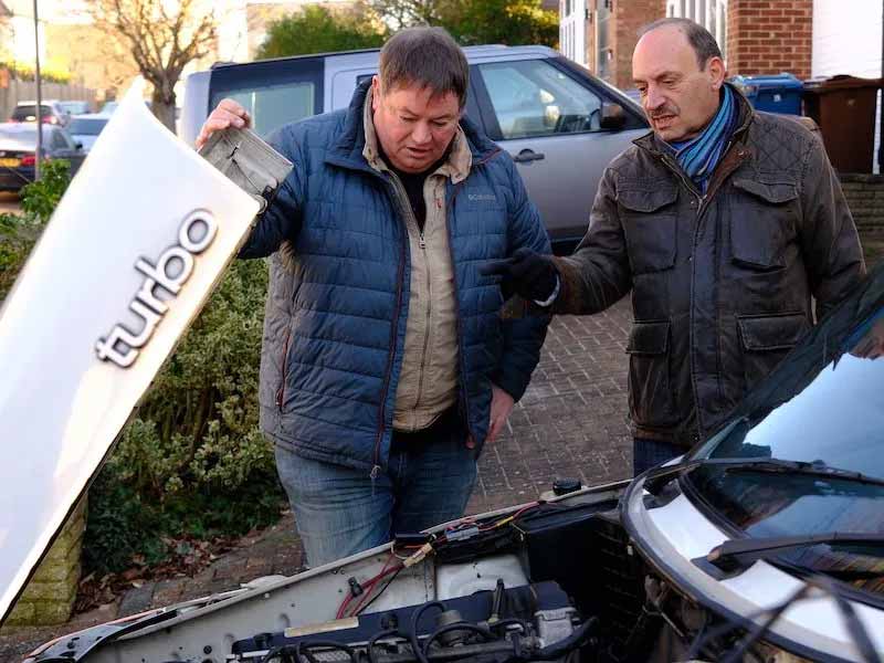 Mike Brewer and Alan inspect the Saab 900 Convertible's engine, uncovering the potential beneath its hood