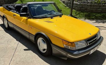 A stunning 1991 Saab 900 SE Turbo Convertible in Monte Carlo Yellow, meticulously maintained and currently up for auction on Bring-a-Trailer.