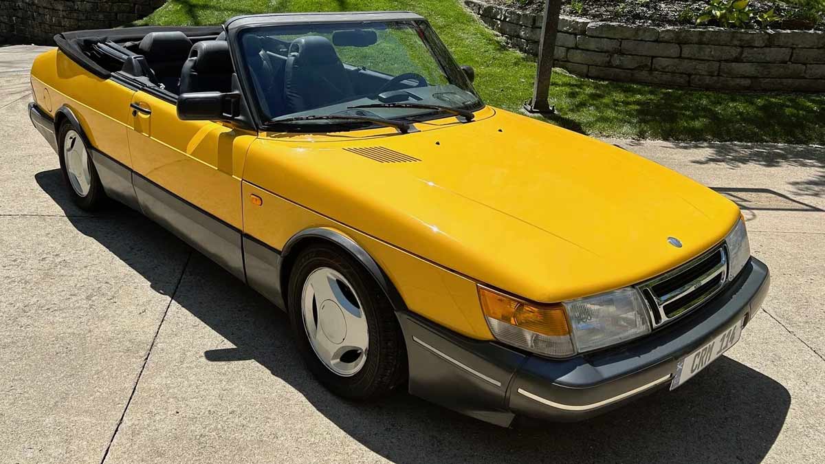 A stunning 1991 Saab 900 SE Turbo Convertible in Monte Carlo Yellow, meticulously maintained and currently up for auction on Bring-a-Trailer.