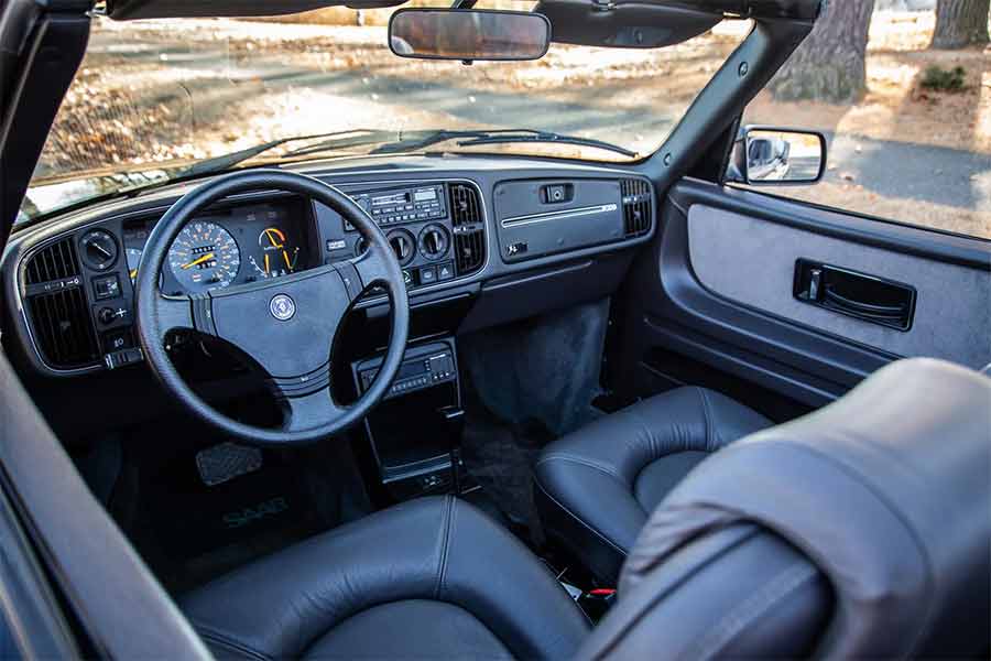 A pristine interior frozen in time—it's almost unimaginable that someone bought this 1988 Saab 900 Turbo Convertible and never experienced the joy of driving it.