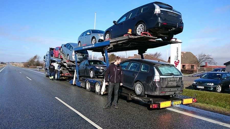 Per Vodder in front of his workshop, 7 pcs Saab just landed from Sweden.