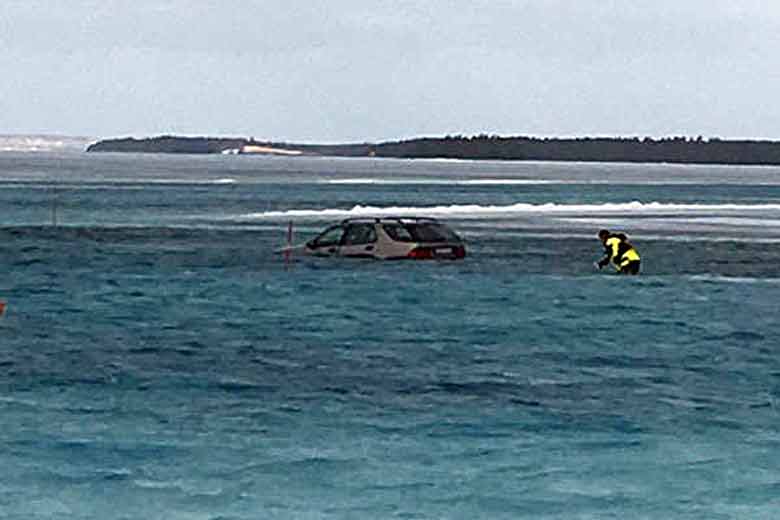 Firefighters Pull Driver from Submerged Saab 9-5