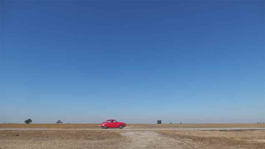 In a cinematic opener, the iconic red Saab 96 darts across the vast landscape, capturing the spirit of a bygone era with its unmistakable two-stroke roar—a perfect blend of nostalgia and artistry.