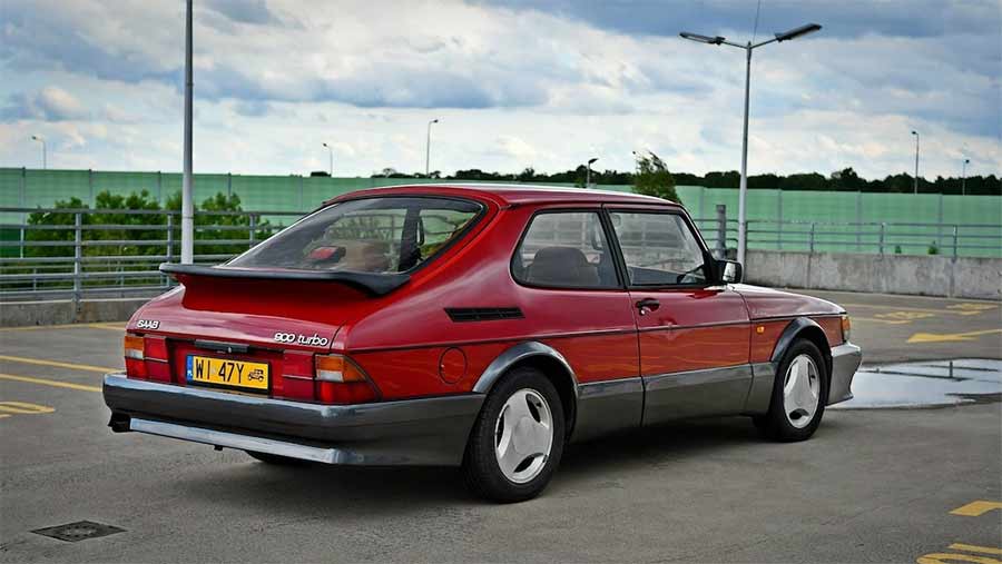 The Saab 900 Red Arrow, often dubbed the 'poor man's Carlsson,' showcasing its distinctive grey AirFlow body kit and iconic 'whale tail' spoiler, a unique feature of this rare Dutch market edition