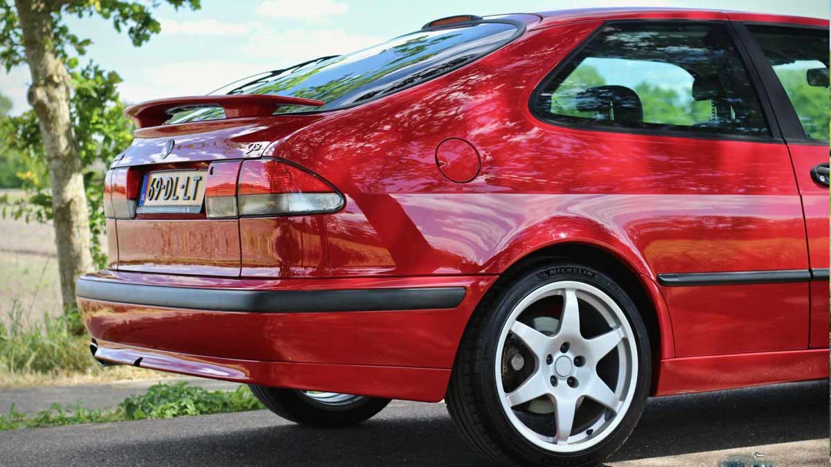 Sleek and Aggressive: The captivating rear end of this Saab 9-3 Aero Coupe showcases its sporty essence, highlighted by the striking spoiler. Prepare to turn heads and leave a lasting impression wherever you go.