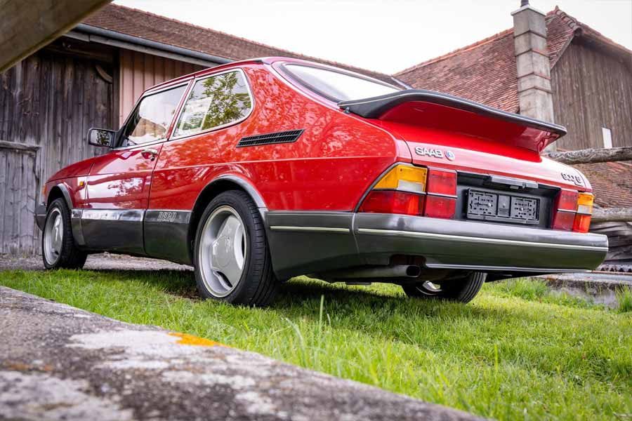 Impeccably preserved 1993 SAAB 900 Turbo Aero in striking red, showcasing its iconic whale tail and distinctive Aero body kit.