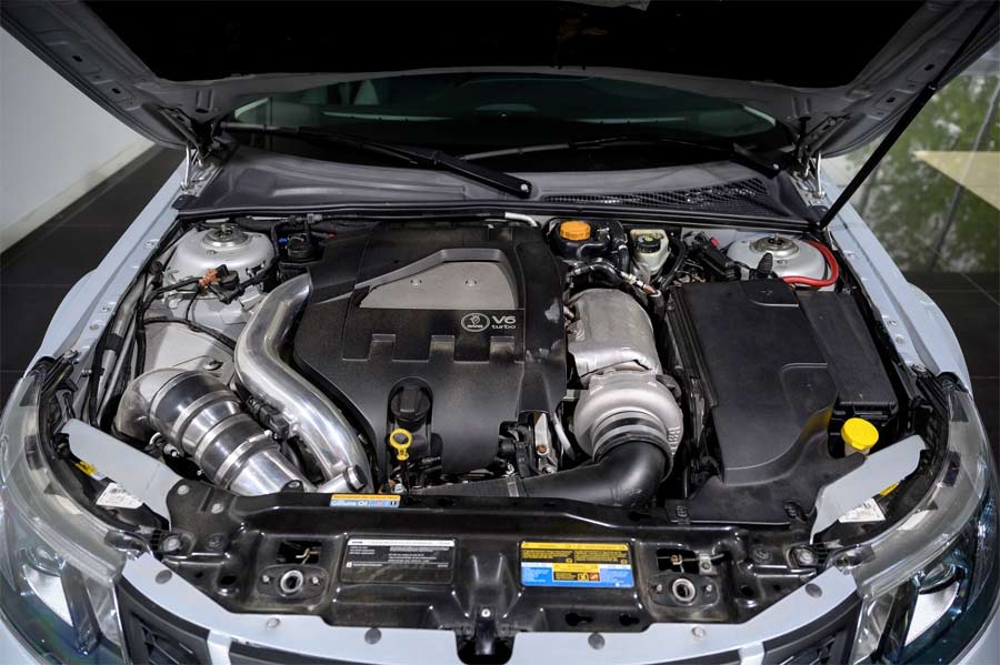 Detailed view of the powerful 3.2-liter V6 turbo engine from an Opel Vectra GTS, expertly installed in a 2008 Saab 9-3 Aero SportSedan, delivering an impressive 700 horsepower and showcasing advanced modifications for peak performance.